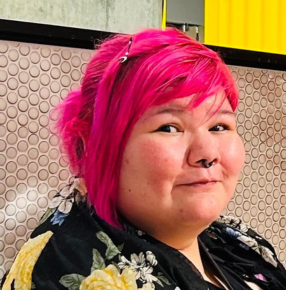 A profile picture of Jen smiling to the camera